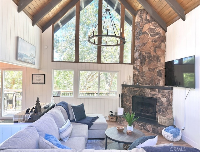 living room featuring wooden walls and a wealth of natural light