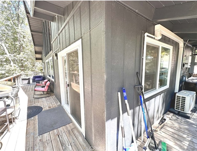 view of side of home with a wooden deck