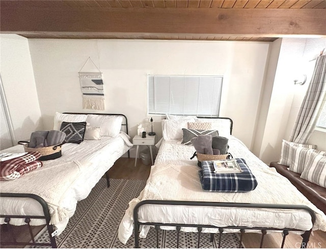 bedroom with wood ceiling, beam ceiling, and hardwood / wood-style flooring