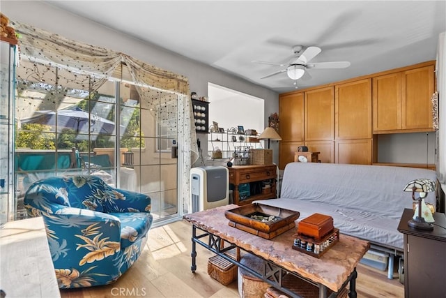 bedroom featuring ceiling fan and light hardwood / wood-style flooring