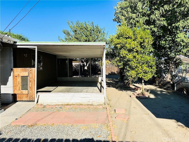 exterior space with a carport