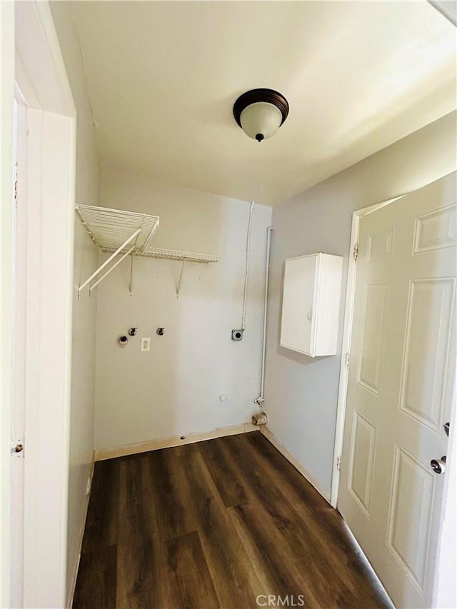 washroom with hookup for an electric dryer, washer hookup, dark hardwood / wood-style flooring, and gas dryer hookup