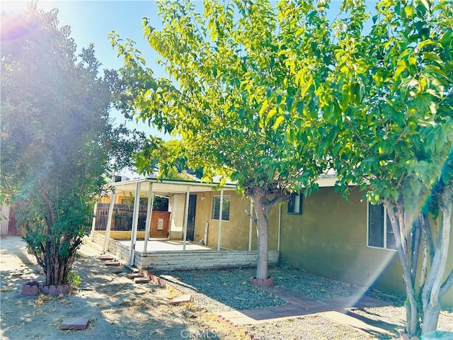 rear view of property featuring a patio area