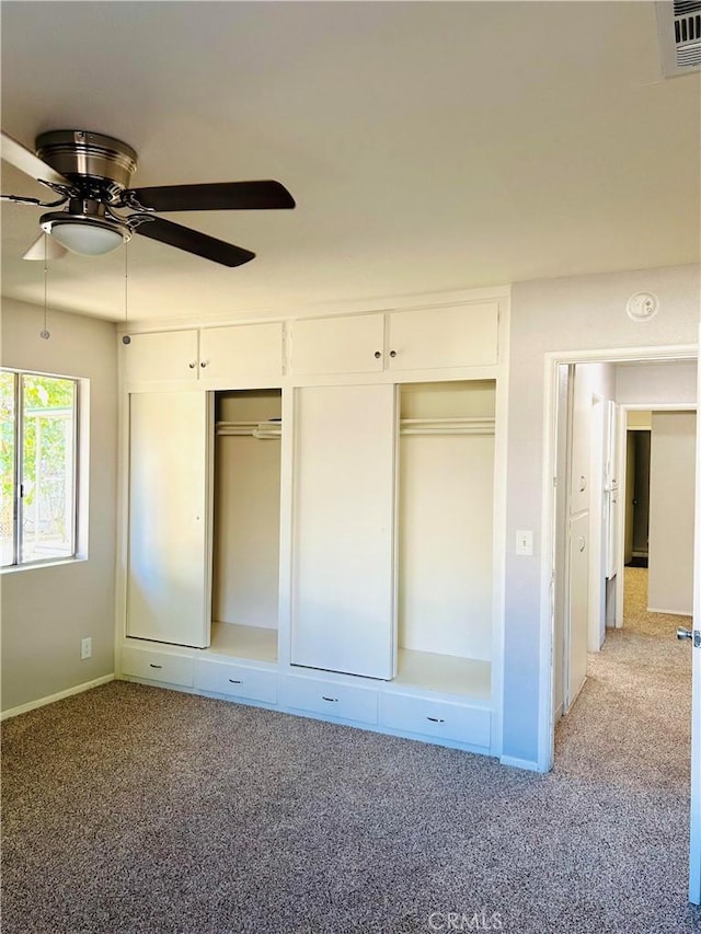 unfurnished bedroom featuring ceiling fan and light colored carpet