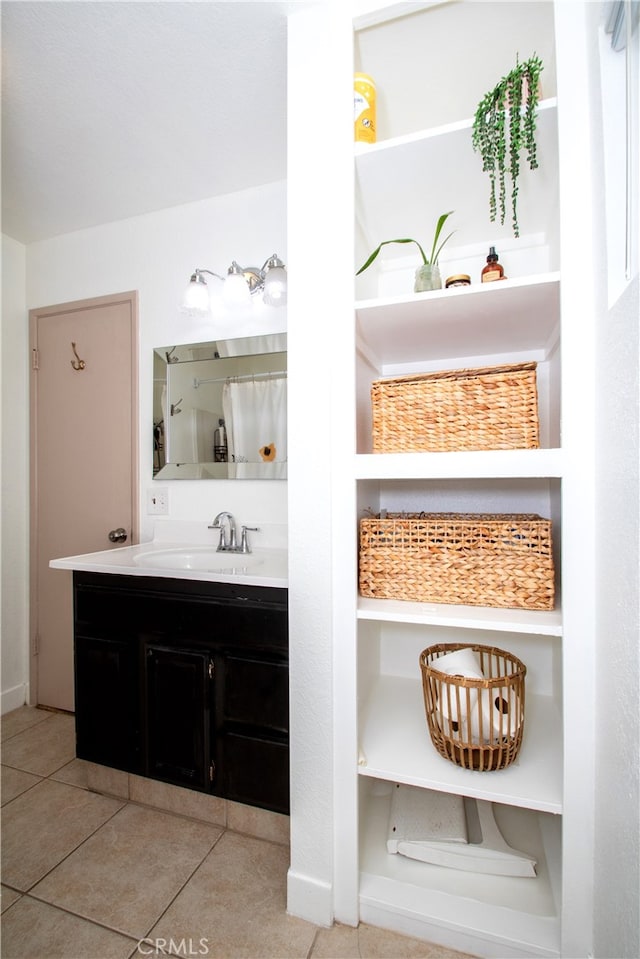 bathroom with vanity and tile patterned floors