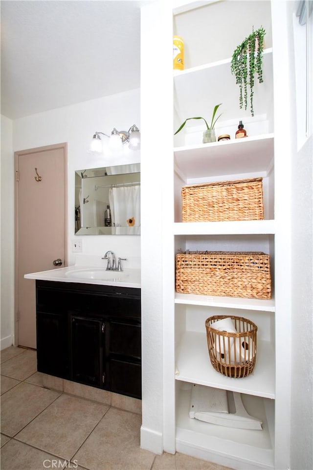full bathroom featuring vanity and tile patterned floors