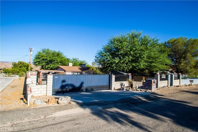 exterior space featuring fence private yard and a gate