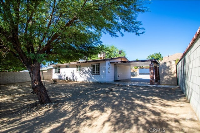 exterior space with a carport