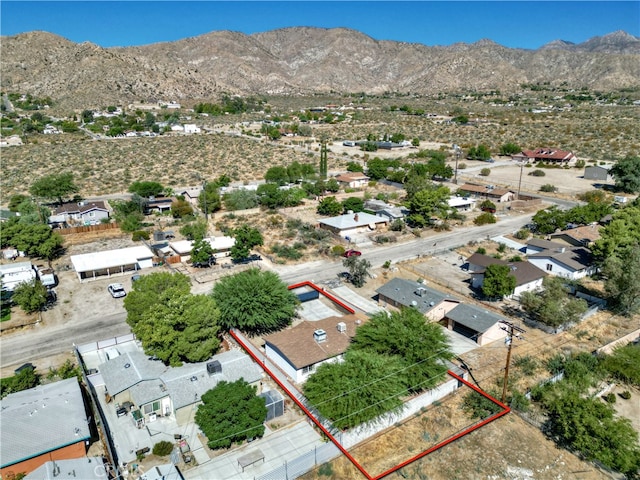 birds eye view of property with a mountain view