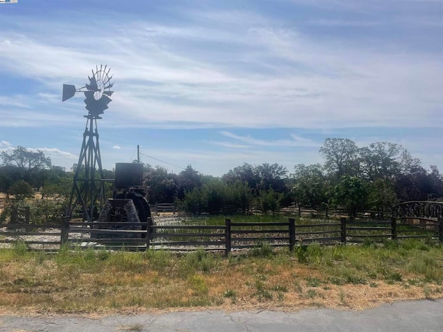 view of yard with a rural view