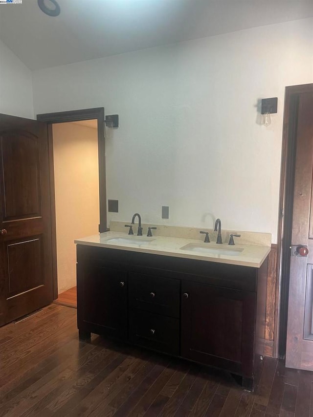 bathroom with wood-type flooring and vanity