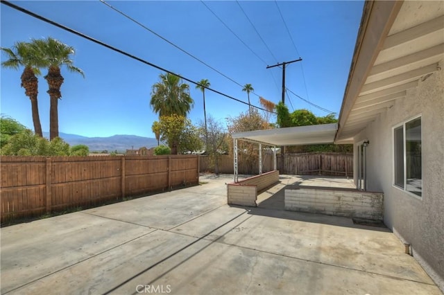 74761 Leslie Ave, Palm Desert, CA 92260 - fenced backyard featuring a patio area and a mountain view