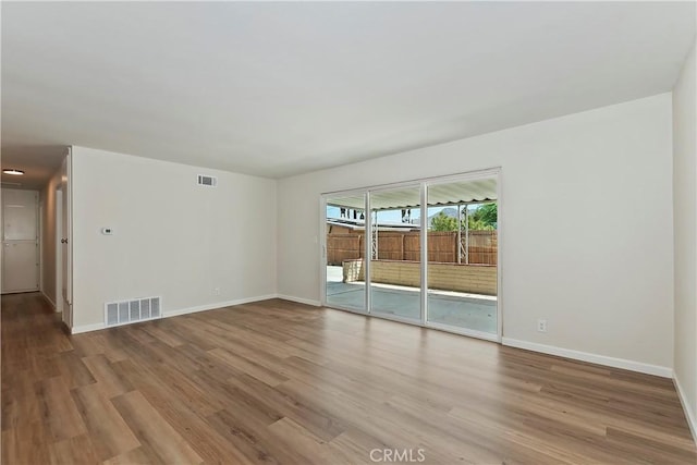 unfurnished room with light hardwood / wood-style flooring