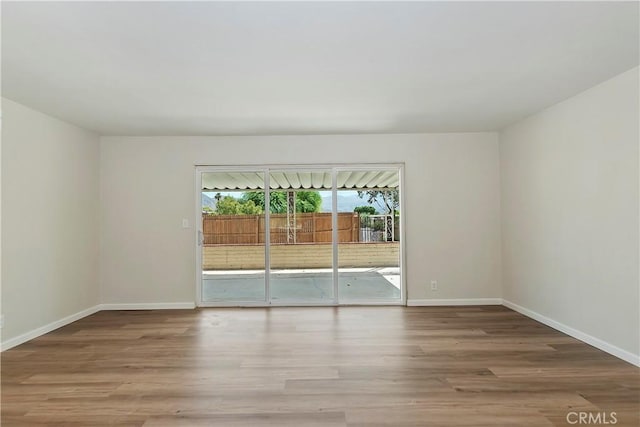 74761 Leslie Ave, Palm Desert, CA 92260 - unfurnished room with wood finished floors and baseboards