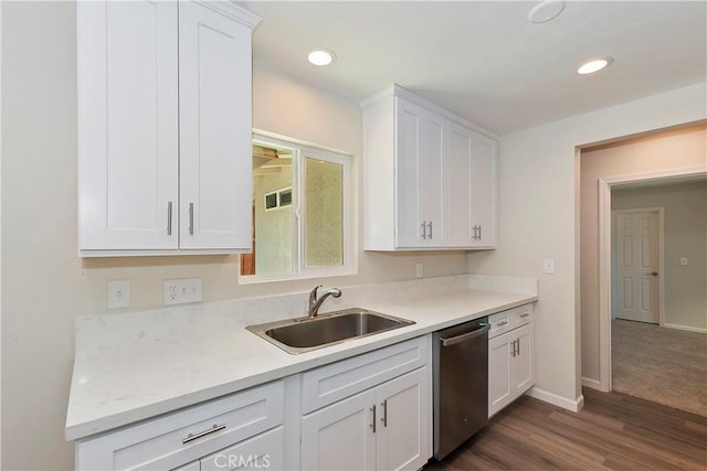 kitchen with sink, white cabinets, stainless steel dishwasher, and dark hardwood / wood-style floors