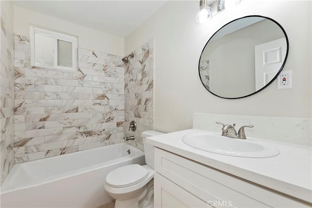 full bathroom with vanity, toilet, and tiled shower / bath