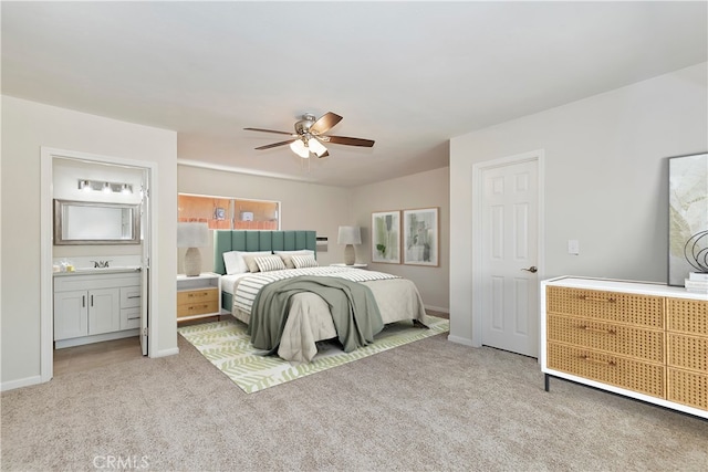 bedroom with light carpet, connected bathroom, ceiling fan, and sink