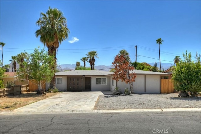 74761 Leslie Ave, Palm Desert, CA 92260 - ranch-style home featuring a mountain view and stucco siding