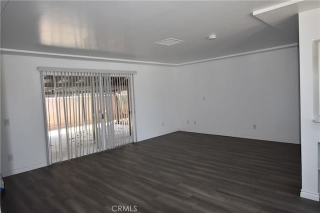 empty room featuring dark hardwood / wood-style flooring