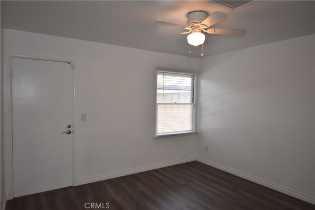 unfurnished room featuring ceiling fan and dark wood-type flooring