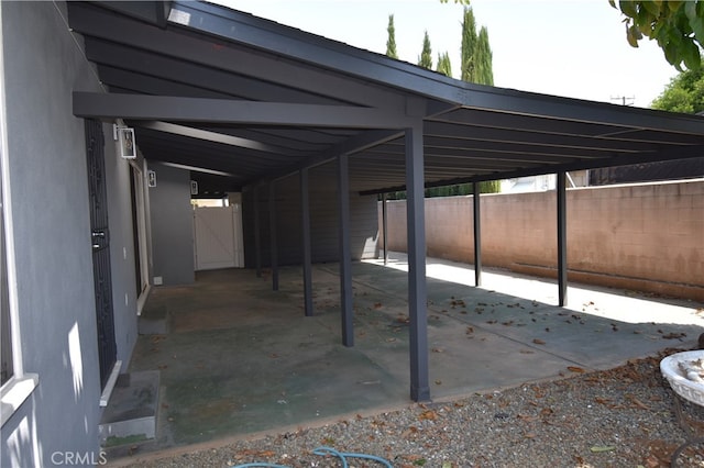 view of patio / terrace featuring a carport