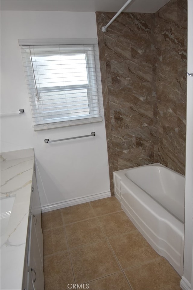 bathroom with tile patterned floors,  shower combination, and vanity