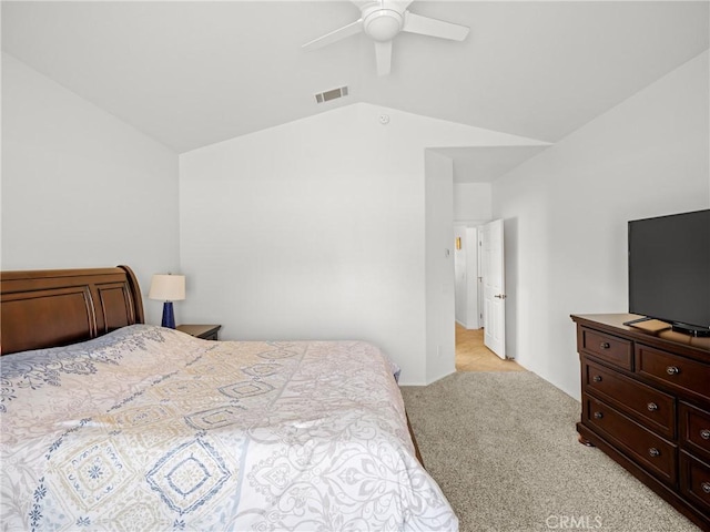 carpeted bedroom with ceiling fan and lofted ceiling