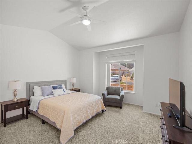 bedroom featuring ceiling fan, light colored carpet, and lofted ceiling