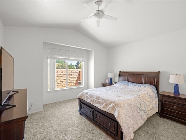 bedroom featuring light carpet, vaulted ceiling, and ceiling fan