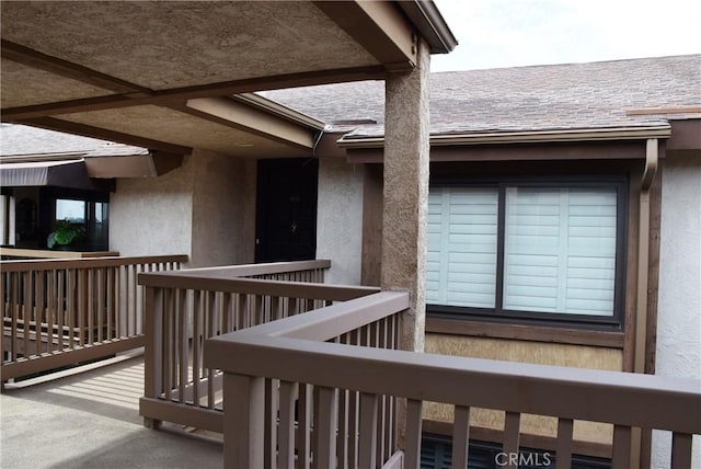 entrance to property featuring a balcony