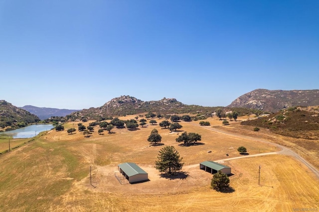 view of mountain feature featuring a rural view and a water view