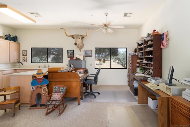 home office with ceiling fan and light colored carpet