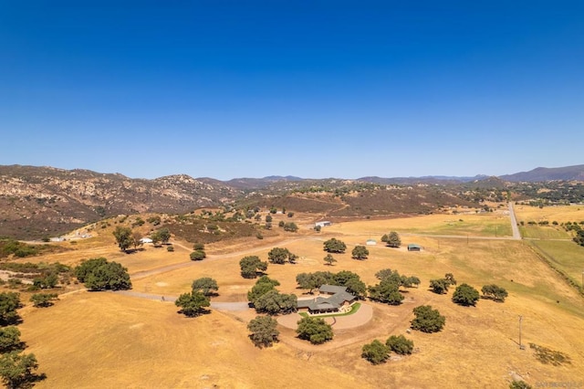 aerial view featuring a mountain view and a rural view