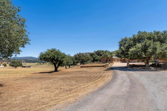 view of street featuring a mountain view and a rural view