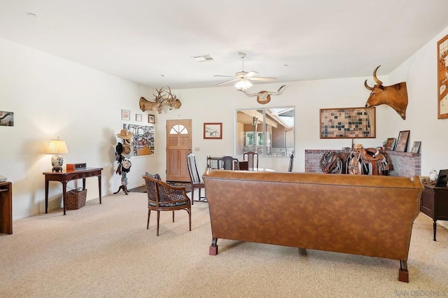 living room featuring light carpet and ceiling fan