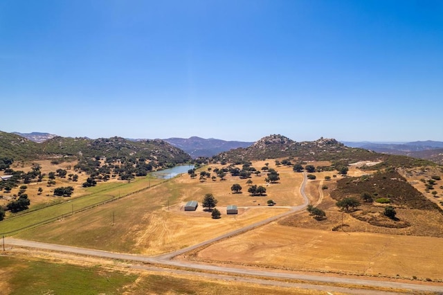 mountain view featuring a rural view and a water view