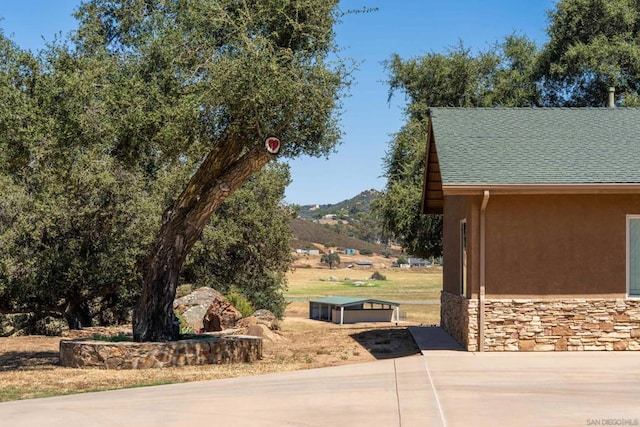 exterior space featuring a mountain view