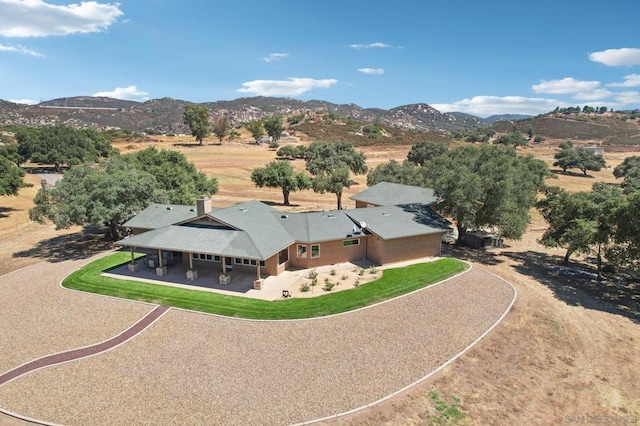 drone / aerial view featuring a mountain view