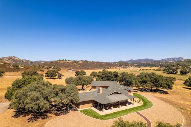 drone / aerial view with a rural view and a mountain view