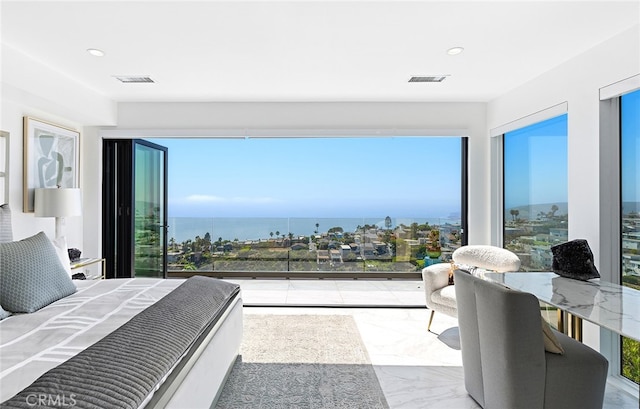 bedroom featuring a water view