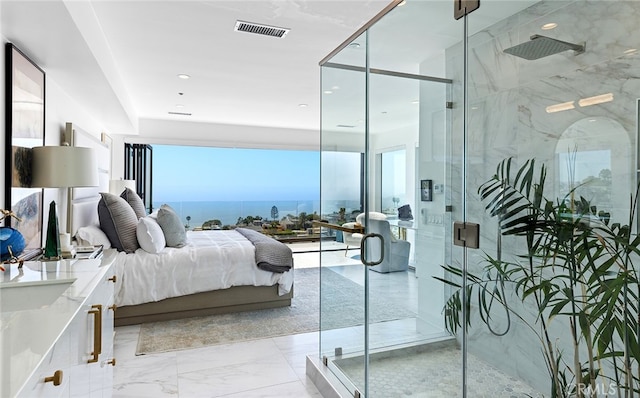 bedroom with a water view and multiple windows