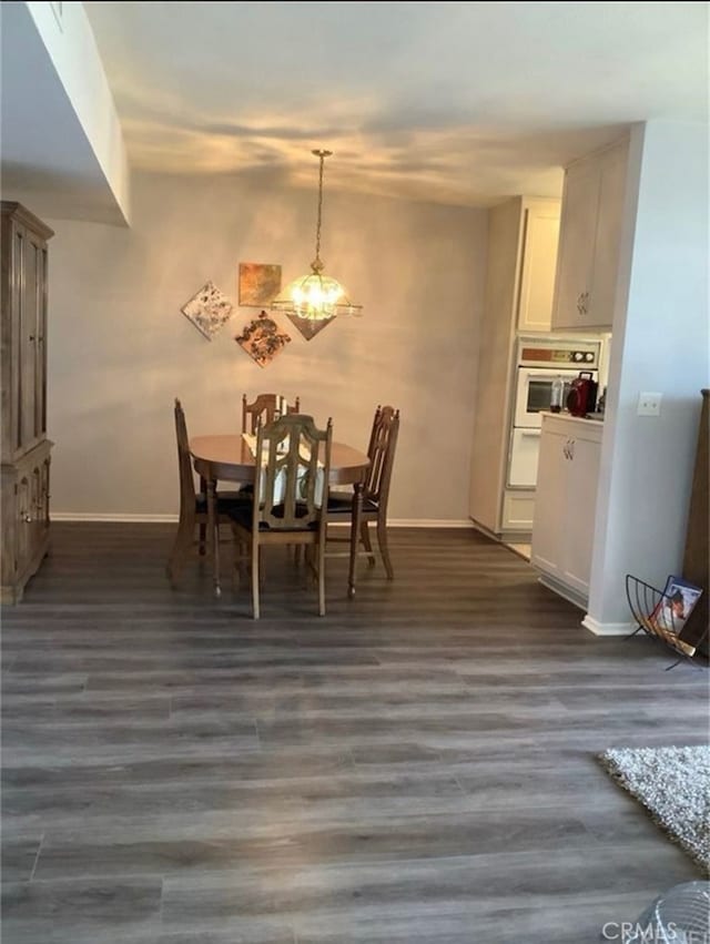 dining room with dark hardwood / wood-style floors