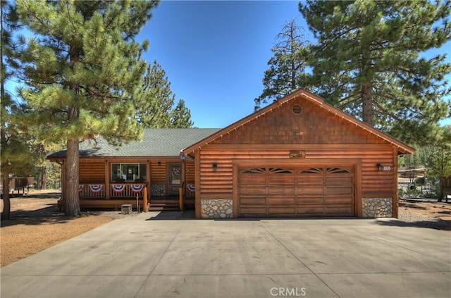 log cabin with a garage