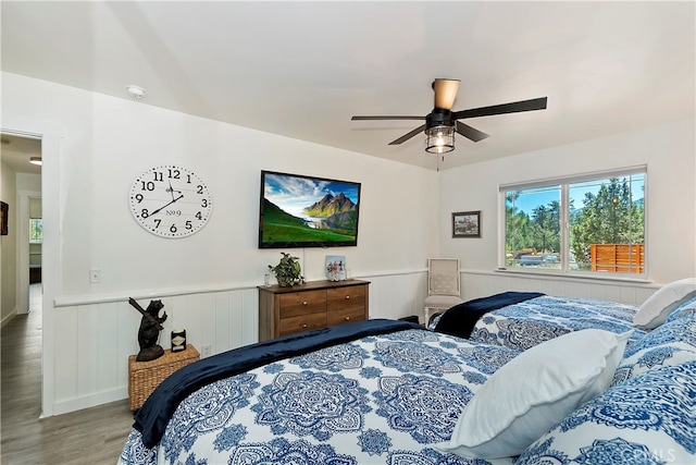 bedroom with ceiling fan and hardwood / wood-style flooring