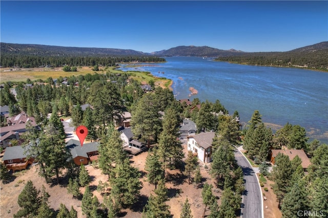 aerial view featuring a water and mountain view