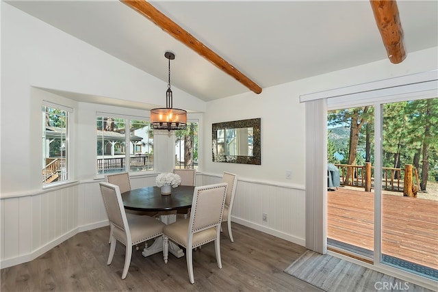 dining space with vaulted ceiling with beams, an inviting chandelier, and dark hardwood / wood-style flooring