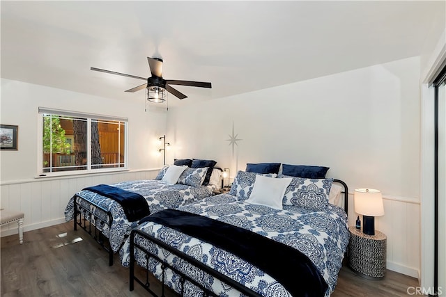 bedroom featuring ceiling fan and dark wood-type flooring