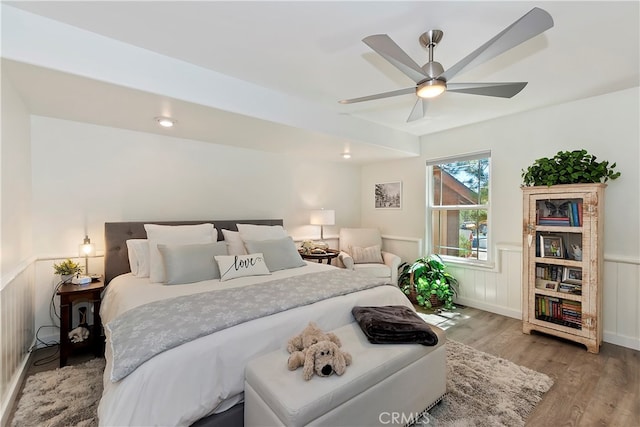 bedroom with light hardwood / wood-style floors and ceiling fan