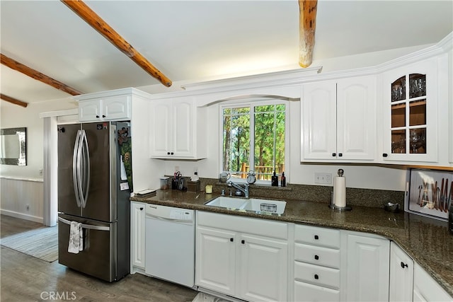 kitchen featuring white cabinets, stainless steel refrigerator, dishwasher, beam ceiling, and sink