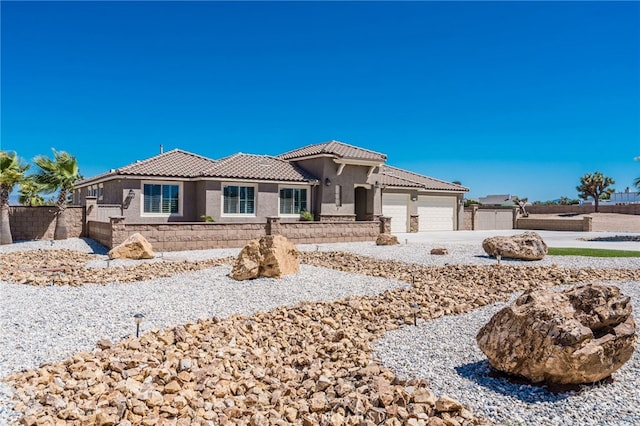 view of front of house with a fire pit and a garage